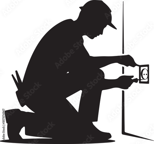 Silhouette of an electrician working on a wall outlet