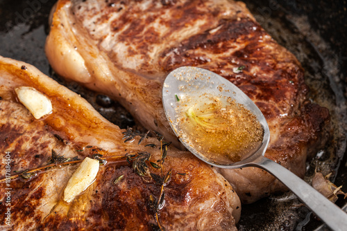 Beef steaks are pan-seared and topped with their own juices and sauce. High quality photo