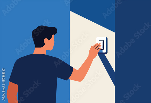 A person with short dark hair, in a dark blue shirt, reaches for a light switch