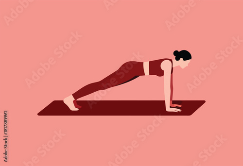 A woman in maroon activewear, bun, in a plank pose on a mat against a solid pink backdrop