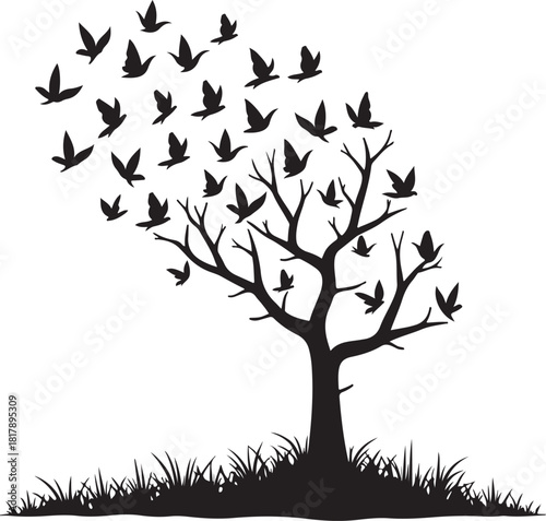 Black silhouette of tree with flock of birds flying away