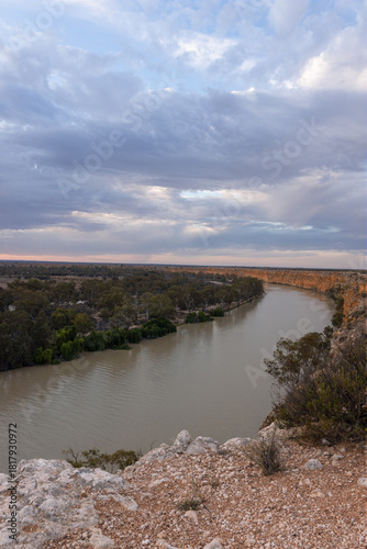 Golden afternoon light illuminates the dramatic limestone cliffs of Big Bend along the River Murray near Swan Reach, South Australia.