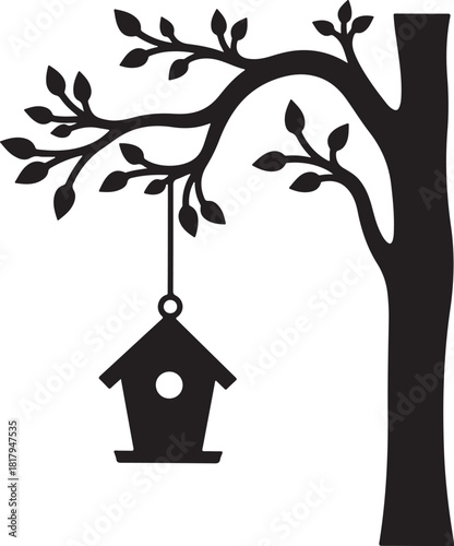 Black silhouette of a birdhouse hanging from a tree branch
