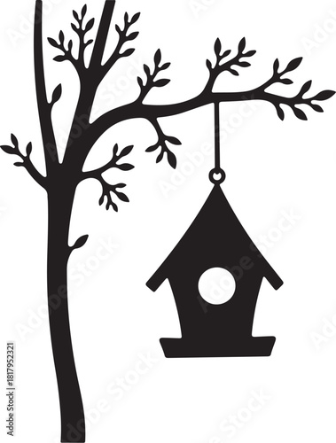 Black silhouette of a tree branch with a birdhouse