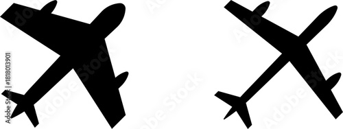 Two silhouetted jet airplanes facing opposite directions