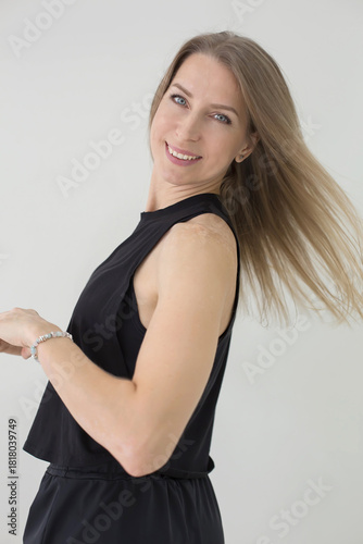 Smiling Woman with Flowing Blonde Hair