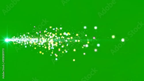 Abstract green background with a dazzling trail of light and sparkling particles