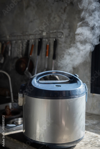 Hot steam from an electric rice cooker in the kitchen