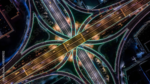 Cuadro en lienzo Illuminated Highway Interchange Aerial Night View with Traffic Flow