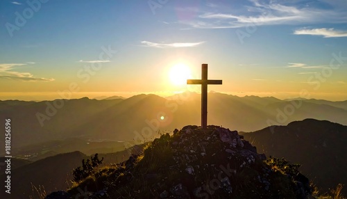 Cross silhouette on mountain peak with a golden sunrise in the background, casting warm rays