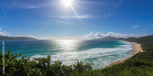 Fototapeta Naklejka Na Ścianę i Meble -  Sandy beach with Atlantic Ocean waves in a scenic coastal setting, ideal for background or layout use