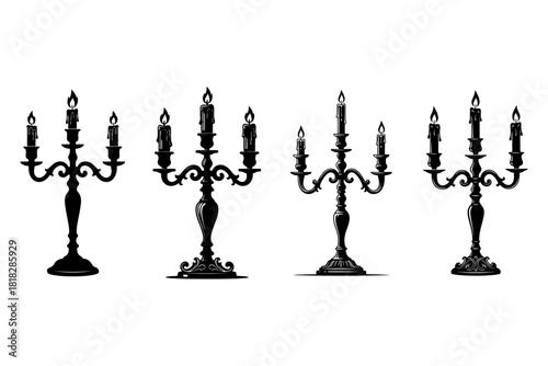 A set of four elegant black silhouette candelabras with burning candles, showcasing vintage, gothic, and baroque styles isolated on a white background