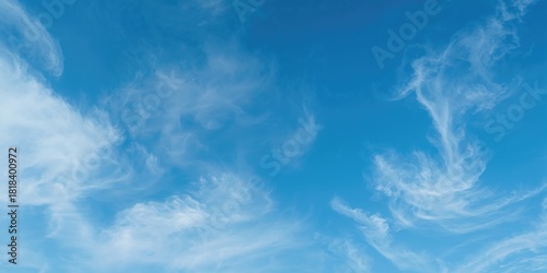 Clear blue sky with small c...
