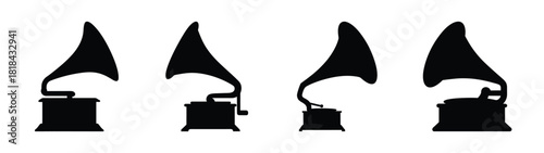 Set of four vintage gramophones silhouette icons representing retro music and old technology