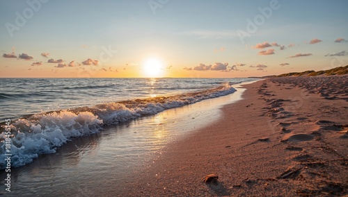 Fototapeta Naklejka Na Ścianę i Meble -  Baltic sea shore at sunset with gentle sunlight and glowing clouds, waves and water splashes, suitable as a background for text or layout