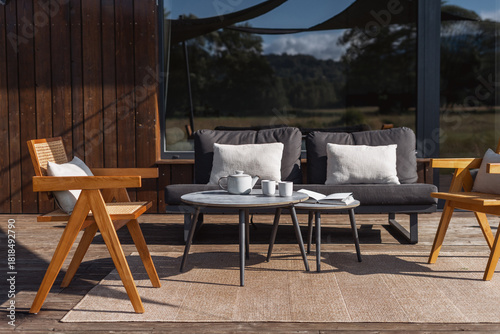 Modern wooden terrace with stylish furniture for outdoor relaxation and coffee time