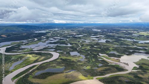 Canvas-taulu Stunning aerial view of Alaskan wilderness with winding rivers, lakes, and lush