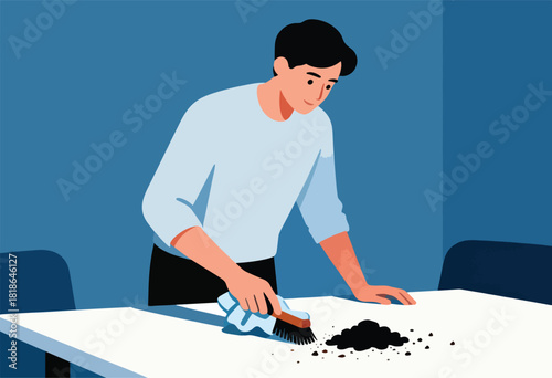 A person in a light blue shirt cleans a white table with a brush, removing a pile of black dirt