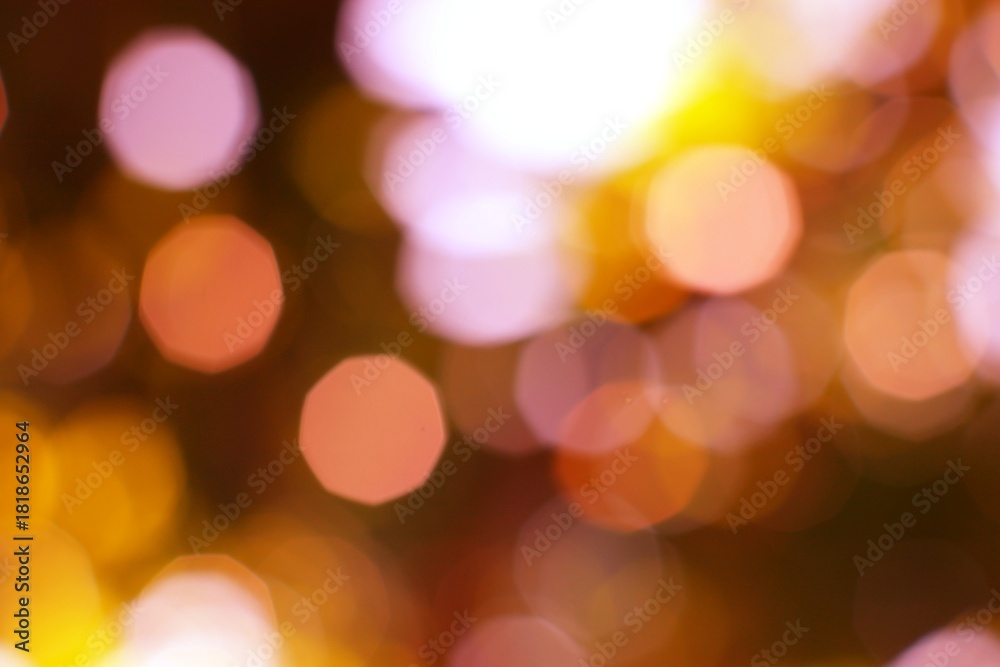 Fototapeta premium Blurred circle light effects create a warm vibrant glow