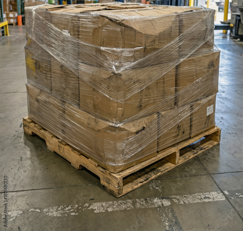Scuffed Shrink-Wrapped Pallet of Damaged Boxes on Warehouse Floor – Everyday Freight Handling