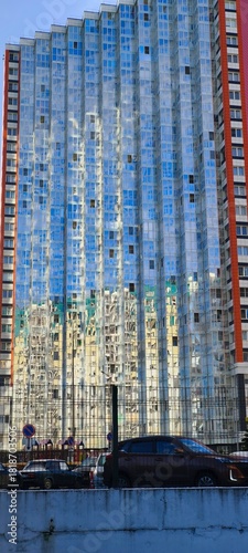 High-rise glazed apartment building with transparent windows