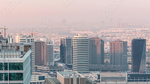 Dawn in big city Dubai from night to morning transition aerial timelapse