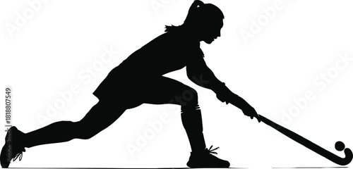 Silhouette of a female athlete in action, skillfully playing field hockey with her stick, showing determination and focus
