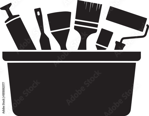 Painting tools in a tray with brushes rollers and sprayer for art and home improvement