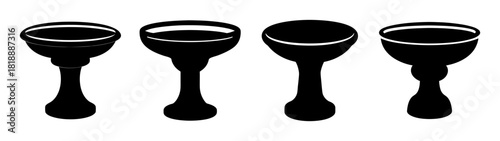 Four black bird baths silhouettes various heights and designs garden decor elements
