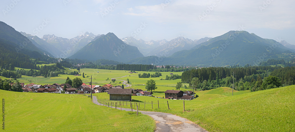 Naklejka premium View from lookout hill tourist resort of Rubi, as far as Oberstdorf in the Allgäu Alps.