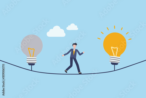 Businessman walking on a tightrope between two ideas one bright one dim