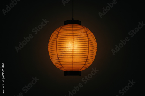 Japanese paper lantern illuminating dark zen background