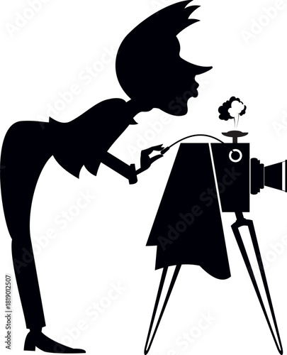 Young man with retro camera making shot. Black and white