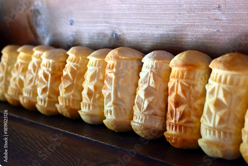 Fototapeta Naklejka Na Ścianę i Meble -  Oscypek cheese, traditional Tatra Mountains product of Poland. Smoked cheese made of salted sheep milk exclusively in the Tatra Mountains region of Poland