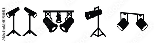 Collection of stage lights featuring spotlights and theatre lighting equipment on stands