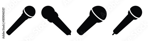 Four dynamic black microphones in motion on a for music and performance