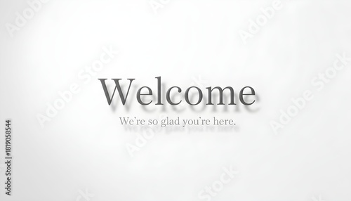 Elegant 'Welcome' text with a subtle shadow and 'We're so glad you're here' message on a clean white background.