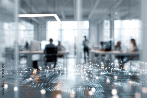 Blurry office scene depicting workers at desks, with digital overlay foreground