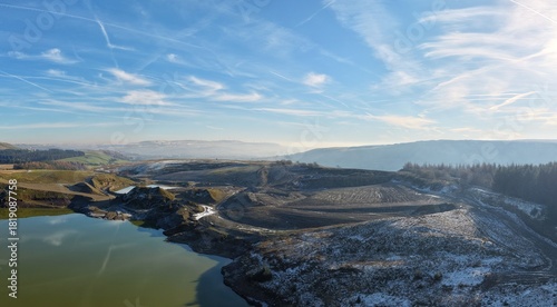 Aerial view of mountains and countryside on a cold winters day with frost and low clouds. Taken in Bury Lancashire England. 