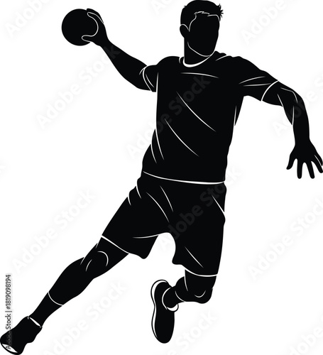 Silhouette of male handball player jumping and throwing ball