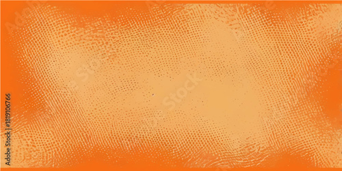 Gold beer glass with orange textured paper surface background