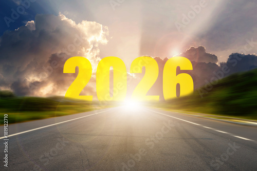 Bright sunrise over an open road with bold 2026 numbers symbolizing new beginnings, future goals, and hope for the year ahead.