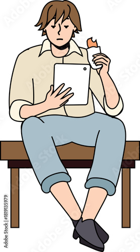 軽食を食べながらタブレットを見る男性