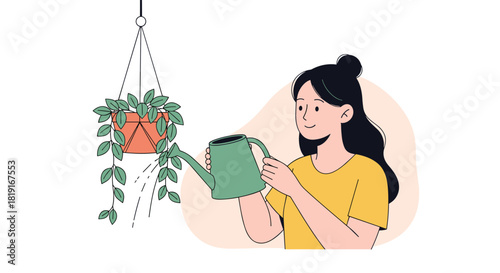 A young woman in a yellow shirt waters a hanging plant with a green watering can.