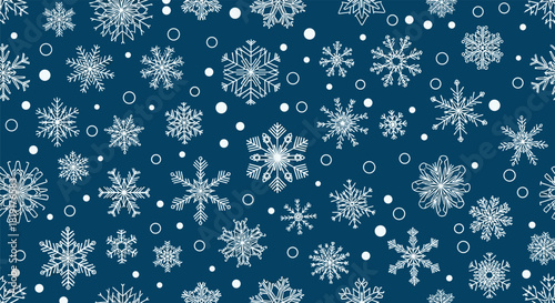 Seamless pattern of white snowflakes and circles on a dark blue background.