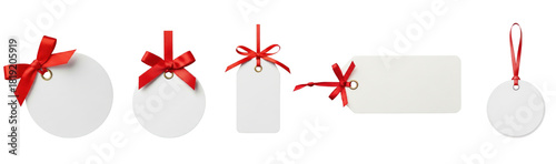 Collection of white price tag with a red ribbon tied around it.