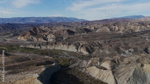 Cinematic Aerial View: The Arid, Dry Terrain of the Tabernas Desert, Andalusia, Illustrating Growing Desertification in Southern Spain