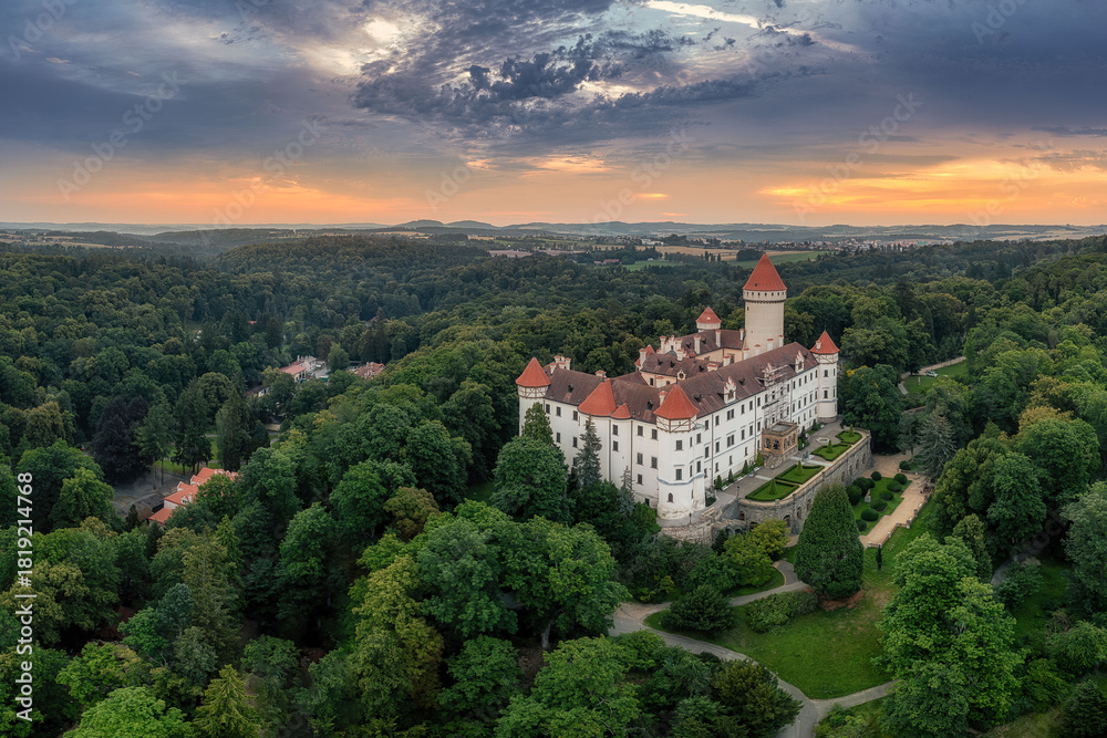 Fototapeta premium view of Konopiste Castle at sunrise in the fog
