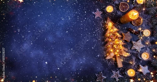 Cozy Christmas decorations arranged on dark black stone with gentle falling snow creating a festive winter atmosphere. Ideal as a holiday background or seasonal backdrop.