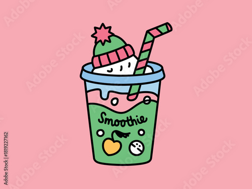 A cheerful green smoothie in a cup with a striped straw and a knitted hat sits against a pink background.